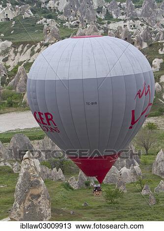 "Hot-air balloon flight over the Fairy Chimneys made of tufa, Goreme National Park, Cappadocia, Nevsehir Province, Central Anatolia Region, Turkey, Asia" View Large Photo Image Stock Image - "Hot-air balloon flight over the Fairy Chimneys made of tufa, Goreme National Park, Cappadocia, Nevsehir Province, Central Anatolia Region, Turkey, Asia". Fotosearch