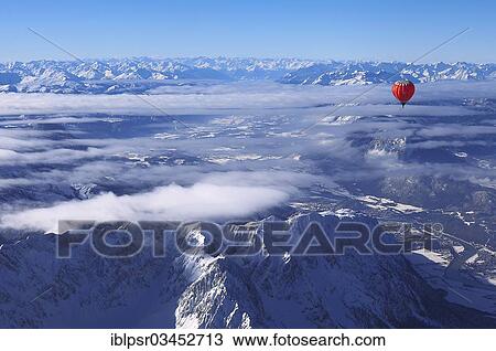 "Hot-air balloon flying over Wilder Kaiser Mountain, Kossen, Tyrol, Austria, Europe" View Large Photo Image Stock Image - "Hot-air balloon flying over Wilder Kaiser Mountain, Kossen, Tyrol, Austria, Europe". Fotosearch