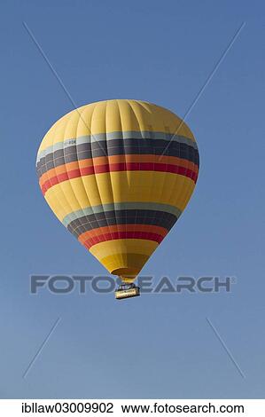 Stock Image - "Hot-air balloon, Goreme National Park, Cappadocia, Nevsehir Province, Central Anatolia Region, Turkey, Asia". Fotosearch