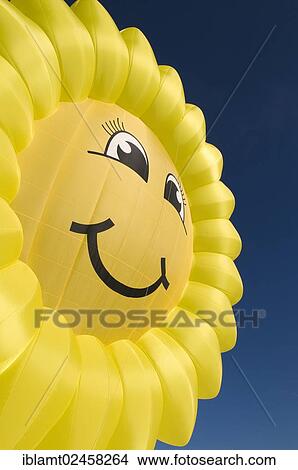 "Hot air balloon in the shape of a """"laughing"""" sun or sunflower against a blue sky, 12th balloon festival of Tegernsee, Montgolfiade, Bad Wiessee, Tegernsee, Bavaria, Germany, Europe" View Large Photo Image Picture - "Hot air balloon in the shape of a """"laughing"""" sun or sunflower against a blue sky, 12th balloon festival of Tegernsee, Montgolfiade, Bad Wiessee, Tegernsee, Bavaria, Germany, Europe". Fotosearch