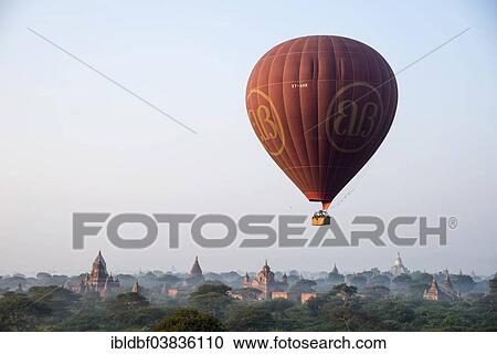 "Hot air balloon over the landscape in morning light, temples, stupas, pagodas, temple complex, Plateau of Bagan, Mandalay Division, Burma or Myanmar" View Large Photo Image Stock Image - "Hot air balloon over the landscape in morning light, temples, stupas, pagodas, temple complex, Plateau of Bagan, Mandalay Division, Burma or Myanmar". Fotosearch