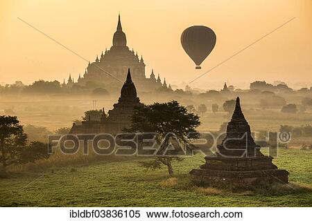 Stock Photography - "Hot air balloon over the landscape in the early morning fog, Sulamani Temple, stupas, pagodas, temple complex, Plateau of Bagan, Mandalay Division, Burma or Myanmar". Fotosearch