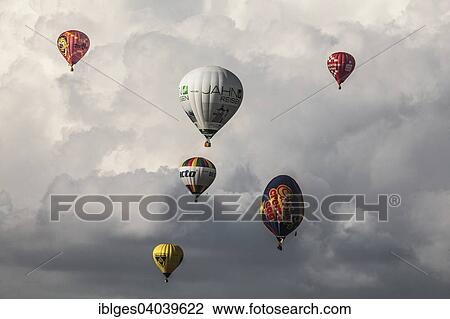 Hot air balloon ride with clouds View Large Photo Image Stock Image - Hot air balloon ride with clouds. Fotosearch