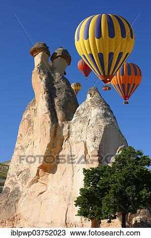 Stock Image - "Hot air balloons and fairy chimneys, near Zelve, Cappadocia, Turkey, Asia". Fotosearch