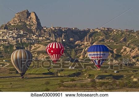 "Hot-air balloons landing, Goreme National Park, Cappadocia, Nevsehir Province, Central Anatolia Region, Turkey, Asia" View Large Photo Image Stock Image - "Hot-air balloons landing, Goreme National Park, Cappadocia, Nevsehir Province, Central Anatolia Region, Turkey, Asia". Fotosearch