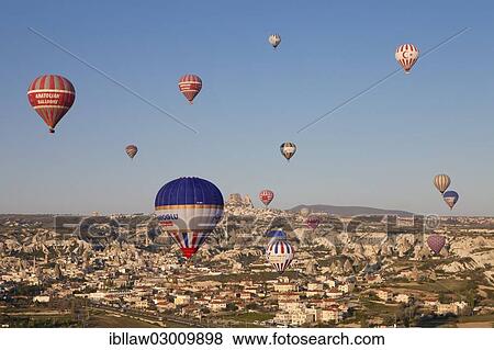 "Hot-air balloons over Goereme, Goreme National Park, Goreme, Cappadocia, Nevsehir Province, Central Anatolia Region, Turkey, Asia" View Large Photo Image Stock Photo - "Hot-air balloons over Goereme, Goreme National Park, Goreme, Cappadocia, Nevsehir Province, Central Anatolia Region, Turkey, Asia". Fotosearch