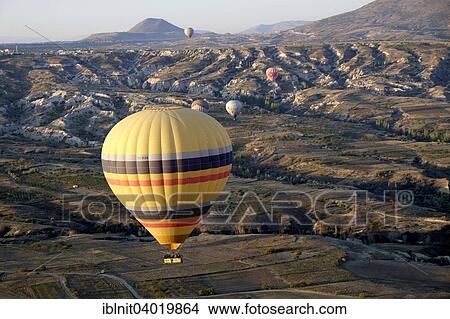 "Hot air balloons over Goreme, Cappadocia, Central Anatolia Region, Turkey, Asia" View Large Photo Image Picture - "Hot air balloons over Goreme, Cappadocia, Central Anatolia Region, Turkey, Asia". Fotosearch
