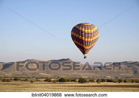 "Hot air balloons over Goreme, Cappadocia, Central Anatolia Region, Turkey, Asia" View Large Photo Image Stock Photo - "Hot air balloons over Goreme, Cappadocia, Central Anatolia Region, Turkey, Asia". Fotosearch