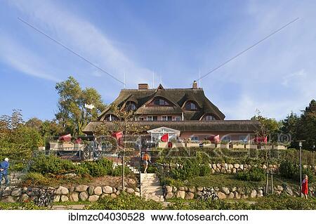 "Hotel and Restaurant """"Namenlos"""" with a thatched roof, Ahrenshoop, Darss, Mecklenburg Western Pomerania, Germany, Europe" View Large Photo Image Stock Photo - "Hotel and Restaurant """"Namenlos"""" with a thatched roof, Ahrenshoop, Darss, Mecklenburg Western Pomerania, Germany, Europe". Fotosearch