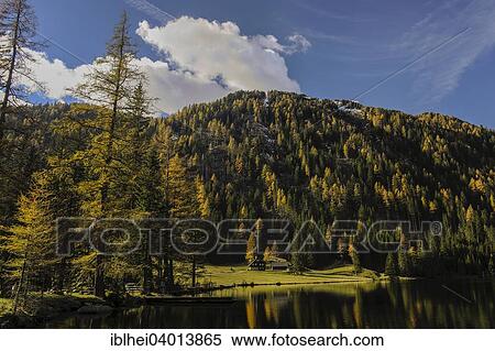 "House at Etrachsee Lake in autumn, Krakautal valley, Styria, Austria, Europe" View Large Photo Image Stock Photography - "House at Etrachsee Lake in autumn, Krakautal valley, Styria, Austria, Europe". Fotosearch
