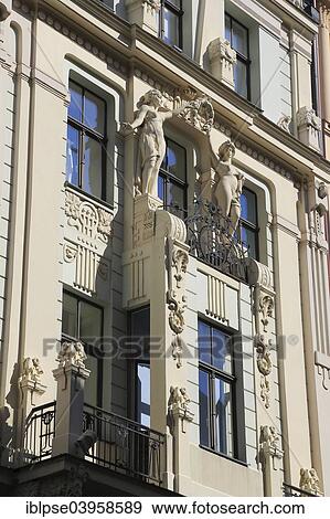 "House facade in Art Nouveau style with two statues holding a wreath, Smilsu iela, Riga, Latvia, Europe" View Large Photo Image Stock Photo - "House facade in Art Nouveau style with two statues holding a wreath, Smilsu iela, Riga, Latvia, Europe". Fotosearch