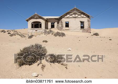 "House of a former diamond miners settlement that is slowly covered by the sand of the Namib Desert, Kolmanskop, ÇKaras, Namibia, Africa" View Large Photo Image Stock Image - "House of a former diamond miners settlement that is slowly covered by the sand of the Namib Desert, Kolmanskop, ÇKaras, Namibia, Africa". Fotosearch