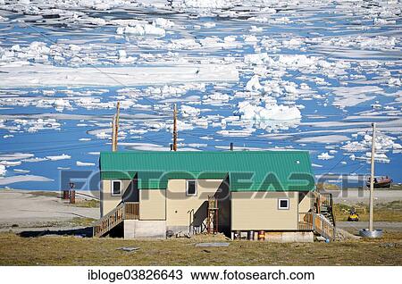 "House of the Inuit people in the village of Ulukhaktok with ice floes in the Beaufort Sea, Arctic Ocean, Victoria Island, formerly Holman Island, Northwest Territories, Canada, North America" View Large Photo Image Stock Image - "House of the Inuit people in the village of Ulukhaktok with ice floes in the Beaufort Sea, Arctic Ocean, Victoria Island, formerly Holman Island, Northwest Territories, Canada, North America". Fotosearch