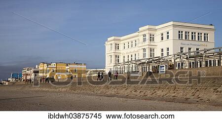 "House on Weststrand beach and Pique Hotel, Norderney, East Frisia, Lower Saxony, Germany, Europe" View Large Photo Image Stock Photography - "House on Weststrand beach and Pique Hotel, Norderney, East Frisia, Lower Saxony, Germany, Europe". Fotosearch