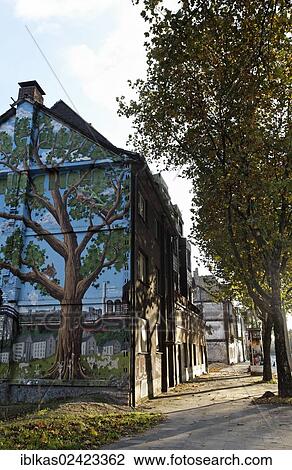 House with a mural of a tree beside a tree-lined avenue, neighborhood redevelopment, green belt project, Duisburg-Bruckhausen, Ruhr area, North Rhine-Westphalia, Germany, Europe View Large Photo Image Stock Image - House with a mural of a tree beside a tree-lined avenue, neighborhood redevelopment, green belt project, Duisburg-Bruckhausen, Ruhr area, North Rhine-Westphalia, Germany, Europe. Fotosearch
