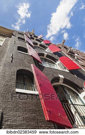 Stock Photo - "House with red shutters, Spuistraat, Amsterdam, Holland, Netherlands, Europe". Fotosearch