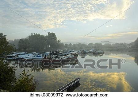 "Houseboat on Saone river, morning atmosphere in the harbour, Vesoul, Haute-Saone, Franche-Comte, France, Europe" View Large Photo Image Stock Image - "Houseboat on Saone river, morning atmosphere in the harbour, Vesoul, Haute-Saone, Franche-Comte, France, Europe". Fotosearch