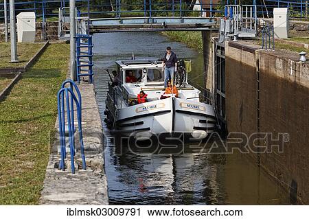 "Houseboat on the Canal des Vosges, formerly Canal de l'Est, entering lock No. 37 to proceed upstream, Ambievillers, Vesoul, Haute-Saone, Franche-Comte, France, Europe" View Large Photo Image Stock Image - "Houseboat on the Canal des Vosges, formerly Canal de l'Est, entering lock No. 37 to proceed upstream, Ambievillers, Vesoul, Haute-Saone, Franche-Comte, France, Europe". Fotosearch