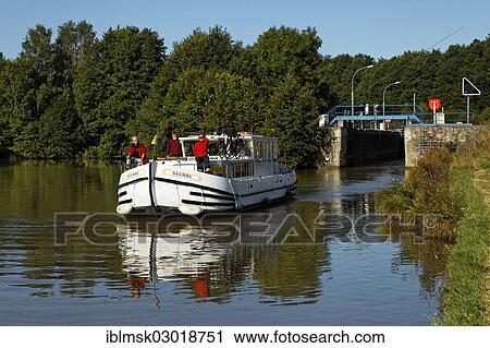 "Houseboat on the Canal des Vosges, formerly the Canal de l'Est, lock staircase with 15 locks at Golbey, Golbey, Epinal, Lorraine, Departement Vosges, France, Europe" View Large Photo Image Stock Image - "Houseboat on the Canal des Vosges, formerly the Canal de l'Est, lock staircase with 15 locks at Golbey, Golbey, Epinal, Lorraine, Departement Vosges, France, Europe". Fotosearch