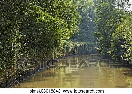 "Houseboat on the Canal des Vosges, formerly the Canal de l'Est, lock staircase with 15 locks at Golbey, canal hewn through rock at the apex of the canal at PK 96, Chaumousey, Epinal, Lorraine, Departement Vosges, France, Europe" View Large Photo Image Stock Image - "Houseboat on the Canal des Vosges, formerly the Canal de l'Est, lock staircase with 15 locks at Golbey, canal hewn through rock at the apex of the canal at PK 96, Chaumousey, Epinal, Lorraine, Departement Vosges, France, Europe". Fotosearch