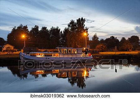 "Houseboat on the Canal des Vosges, formerly Canal de l'Est, evening mood in the harbour, Girancourt, Epinal, Lorraine, Departement Vosges, France, Europe" View Large Photo Image Stock Image - "Houseboat on the Canal des Vosges, formerly Canal de l'Est, evening mood in the harbour, Girancourt, Epinal, Lorraine, Departement Vosges, France, Europe". Fotosearch