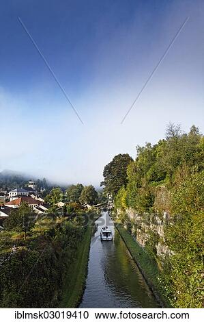 Stock Image - "Houseboat on the Canal des Vosges, formerly Canal de l'Est, with the rocks cut through above lock No. 35, Fontenoy-le-Chateau, Epinal, Lorraine, Departement Vosges, France, Europe". Fotosearch