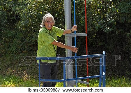 Stock Photo - "Houseboat on the Canal des Vosges, formerly Canal de l'Est, man using a semi-automatic lock on the staircase of locks at Golbey, Golbey, Epinal, Lorraine, Departement Vosges, France, Europe". Fotosearch