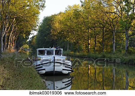 "Houseboat on the Canal des Vosges, formerly Canal de l'Est, at PK 100. 5, evening mood, Girancourt, Epinal, Lorraine, Departement Vosges, France, Europe" View Large Photo Image Stock Photograph - "Houseboat on the Canal des Vosges, formerly Canal de l'Est, at PK 100. 5, evening mood, Girancourt, Epinal, Lorraine, Departement Vosges, France, Europe". Fotosearch