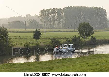 Stock Photo - "Houseboat, penichette, on the Saone River, early morning at Baulay, PK 380, Fouchecourt, Vesoul, Region Franche-Comte, Dep. Haute-Saone, France, Europe". Fotosearch