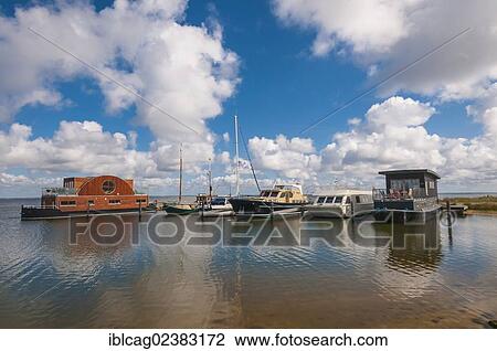 "Houseboats and yachts in the port of Hvide Sande, West Jutland, Denmark, Europe" View Large Photo Image Stock Image - "Houseboats and yachts in the port of Hvide Sande, West Jutland, Denmark, Europe". Fotosearch