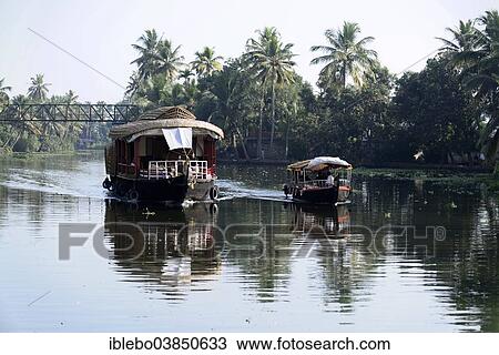 Stock Image - "Houseboats, backwaters, near Alappuzha, Kerala, South India, India, Asia". Fotosearch