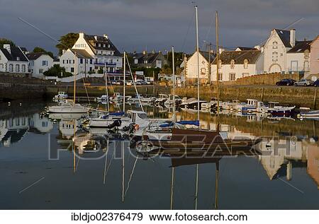 "Houses and boats reflected in the eastern harbor in the early morning, Port-Haliguen in Quiberon, southern Brittany, Bretagne, France, Europe" View Large Photo Image Stock Photo - "Houses and boats reflected in the eastern harbor in the early morning, Port-Haliguen in Quiberon, southern Brittany, Bretagne, France, Europe". Fotosearch