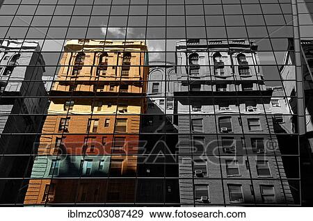 "Houses are reflected in the glass facade of a skyscraper, New York City, New York, United States, North America" View Large Photo Image Stock Photo - "Houses are reflected in the glass facade of a skyscraper, New York City, New York, United States, North America". Fotosearch