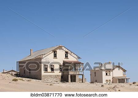 "Houses of a former diamond miners settlement that is slowly covered by the sand of the Namib Desert, Kolmanskop, ÇKaras, Namibia, Africa" View Large Photo Image Stock Image - "Houses of a former diamond miners settlement that is slowly covered by the sand of the Namib Desert, Kolmanskop, ÇKaras, Namibia, Africa". Fotosearch