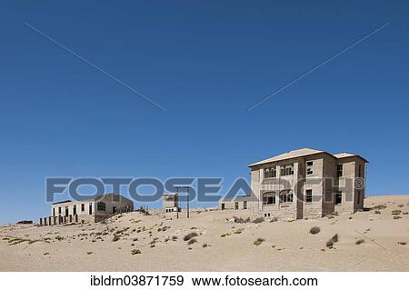 "Houses of a former diamond miners settlement that is slowly covered by the sand of the Namib Desert, Kolmanskop, ÇKaras, Namibia, Africa" View Large Photo Image Stock Photo - "Houses of a former diamond miners settlement that is slowly covered by the sand of the Namib Desert, Kolmanskop, ÇKaras, Namibia, Africa". Fotosearch