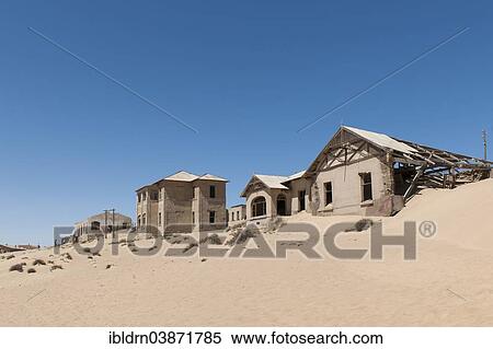 "Houses of a former diamond miners settlement that is slowly covered by the sand of the Namib Desert, Kolmanskop, ÇKaras, Namibia, Africa" View Large Photo Image Stock Photography - "Houses of a former diamond miners settlement that is slowly covered by the sand of the Namib Desert, Kolmanskop, ÇKaras, Namibia, Africa". Fotosearch