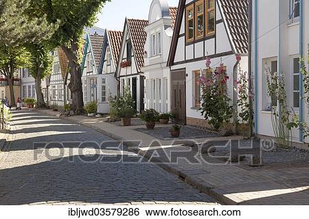 Stock Photograph - "Houses on Alexandrinenstrasse street, Warnemunde, Rostock, Mecklenburg-Western Pomerania, Germany, Europe". Fotosearch