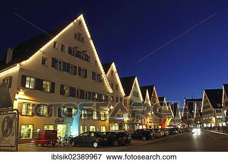 Stock Photo - "Houses on the Marktplatz market square at the blue hour, Biberach an der Riss, Upper Swabia, Baden-Wuerttemberg, Germany, Europe". Fotosearch