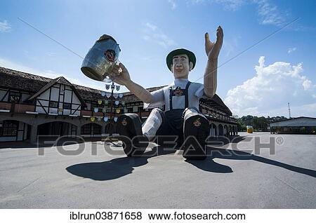 Stock Photo - "Huge inflatable doll wearing traditional Bavarian dress, in front of the Schutzenhalle hall, Jaragua do Sul, Santa Catarina, Brazil, South America". Fotosearch