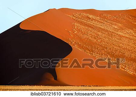 "Huge sand dune in the evening light, Sossusvlei, Namib Desert, Namib Naukluft Park, Namibia, Africa" View Large Photo Image Stock Image - "Huge sand dune in the evening light, Sossusvlei, Namib Desert, Namib Naukluft Park, Namibia, Africa". Fotosearch