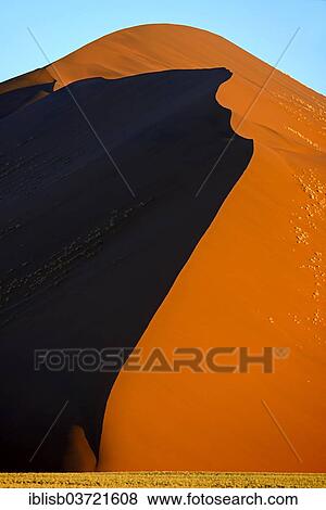 "Huge sand dune in the evening light, Sossusvlei, Namib Desert, Namib Naukluft Park, Namibia, Africa" View Large Photo Image Stock Photo - "Huge sand dune in the evening light, Sossusvlei, Namib Desert, Namib Naukluft Park, Namibia, Africa". Fotosearch