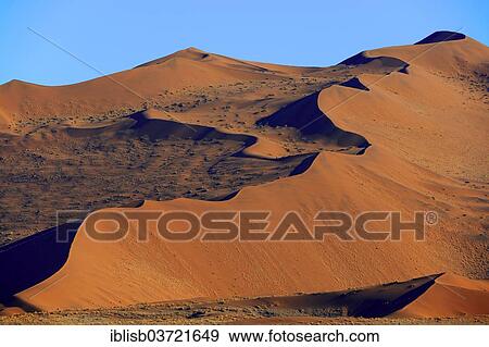"Huge sand dunes in the morning light, Sossusvlei, Namib Wuste, Namib-Naukluft-Nationalpark, Namibia, Namibia, Africa" View Large Photo Image Stock Photo - "Huge sand dunes in the morning light, Sossusvlei, Namib Wuste, Namib-Naukluft-Nationalpark, Namibia, Namibia, Africa". Fotosearch