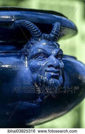 "Human-animal head on an ornamental vessel made of glazed ceramic, West Parterre, Schlosspark palace gardens, Schloss Linderhof Palace, Upper Bavaria, Bavaria, Germany, Europe" View Large Photo Image Stock Photograph - "Human-animal head on an ornamental vessel made of glazed ceramic, West Parterre, Schlosspark palace gardens, Schloss Linderhof Palace, Upper Bavaria, Bavaria, Germany, Europe". Fotosearch