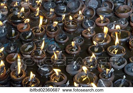 "Hundreds of little oil lamps burning inside the Menakshi-Sundareshwara Temple in Madurai, India, Asia" View Large Photo Image Stock Photo - "Hundreds of little oil lamps burning inside the Menakshi-Sundareshwara Temple in Madurai, India, Asia". Fotosearch