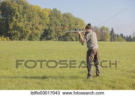 "Hunter waiting for game with weapon at the ready, Offheim, Limburg an der Lahn, Hesse, Germany, Europe" View Large Photo Image Stock Image - "Hunter waiting for game with weapon at the ready, Offheim, Limburg an der Lahn, Hesse, Germany, Europe". Fotosearch
