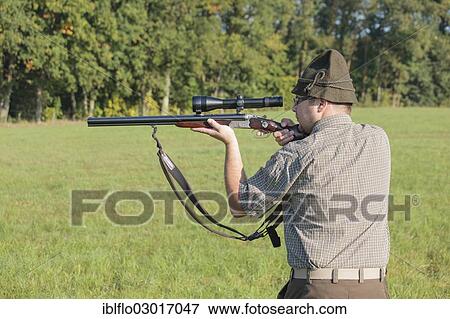"Hunter waiting for game with weapon at the ready, Offheim, Limburg an der Lahn, Hesse, Germany, Europe" View Large Photo Image Stock Photo - "Hunter waiting for game with weapon at the ready, Offheim, Limburg an der Lahn, Hesse, Germany, Europe". Fotosearch