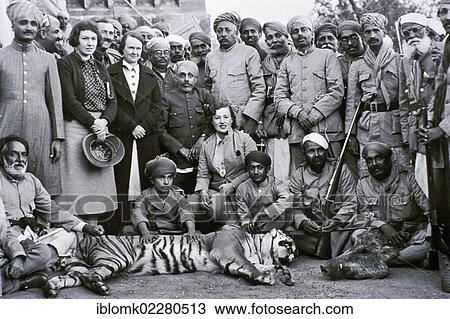 "Hunting party consisting of British and Indians, with Maharana Bhupal Singh of Udaipur, with hunted tiger, historical photography, 1935, British colonial era, British Raj, Udaipur, Rajasthan, India, Asia" View Large Photo Image Stock Image - "Hunting party consisting of British and Indians, with Maharana Bhupal Singh of Udaipur, with hunted tiger, historical photography, 1935, British colonial era, British Raj, Udaipur, Rajasthan, India, Asia". Fotosearch