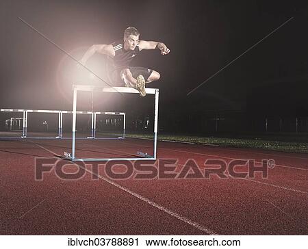 Hurdle racing athlete View Large Photo Image Stock Image - Hurdle racing athlete. Fotosearch