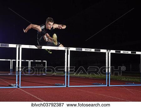 Hurdle racing athlete View Large Photo Image Stock Photo - Hurdle racing athlete. Fotosearch