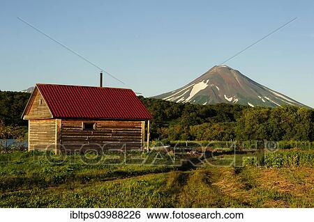 "Hut of a fisheries supervisor at Kurile Lake, Ilinskaya volcano at the back, Kurilensee, Kamchatka Peninsula, Russia, Europe" View Large Photo Image Stock Photograph - "Hut of a fisheries supervisor at Kurile Lake, Ilinskaya volcano at the back, Kurilensee, Kamchatka Peninsula, Russia, Europe". Fotosearch
